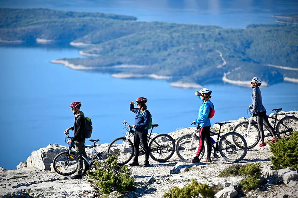 Cycling the Via Brattia trail through olive groves, Brač Island