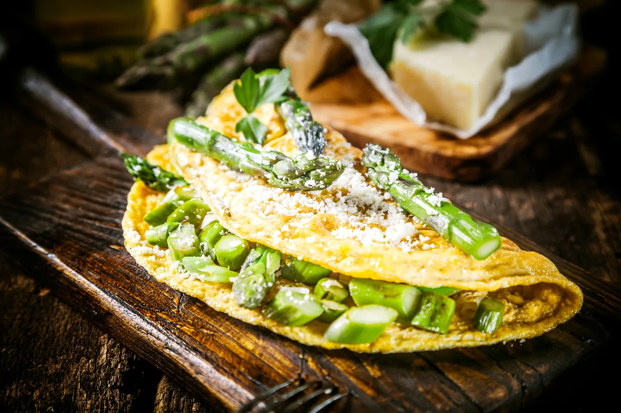 Vegetarian asparagus omelette on a rustic board at a Croatia retreat